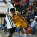 Ypsilanti High School freshman Corey Allen drives against a Huron defender in the first quarter of the game on Friday, March 8. Daniel Brenner I AnnArbor.com